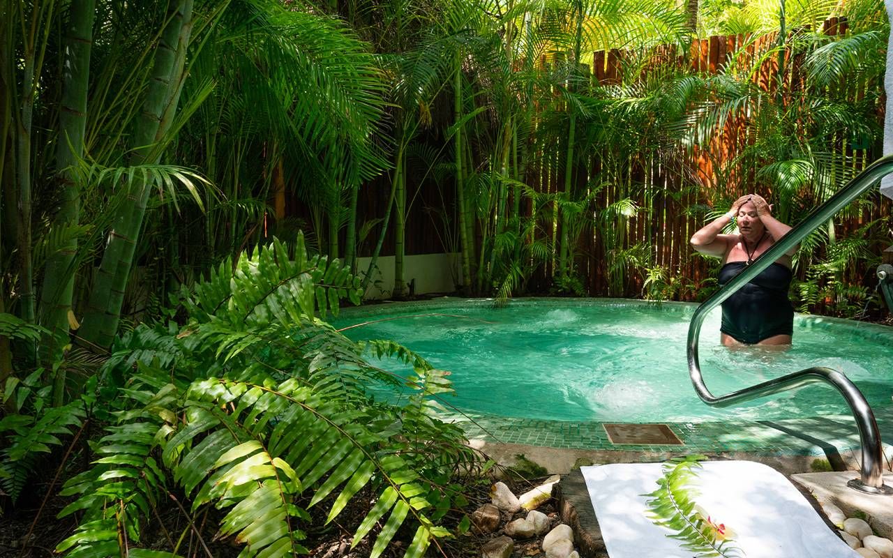 A person in a hot tub after doing aquatic therapy. Next Avenue, benefits