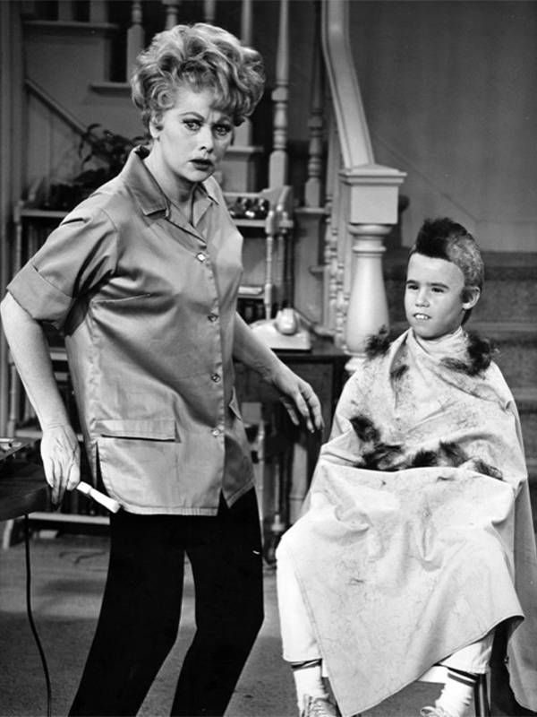 A black and white photo of Lucille Ball giving a haircut. Next Avenue, My Three Sons