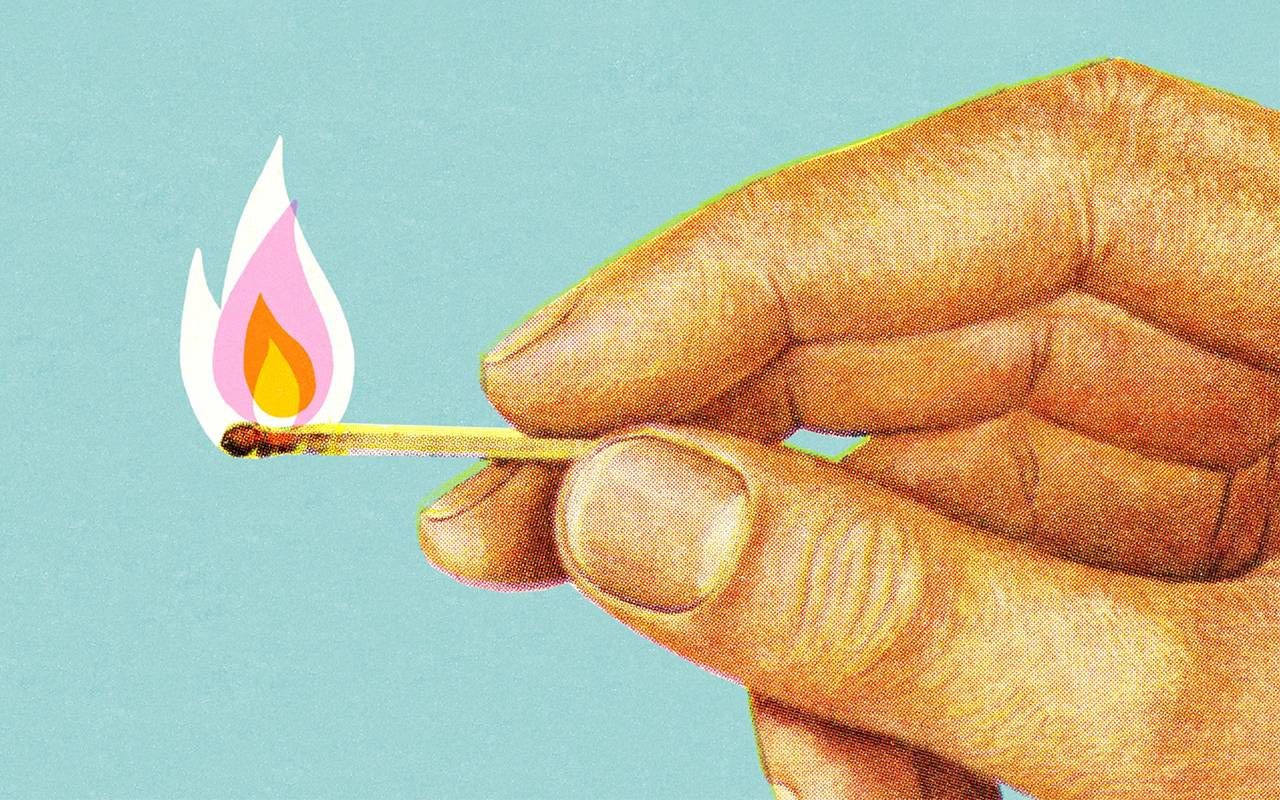 An illustration of a person holding a lit match. Next Avenue, burnout, holiday stress