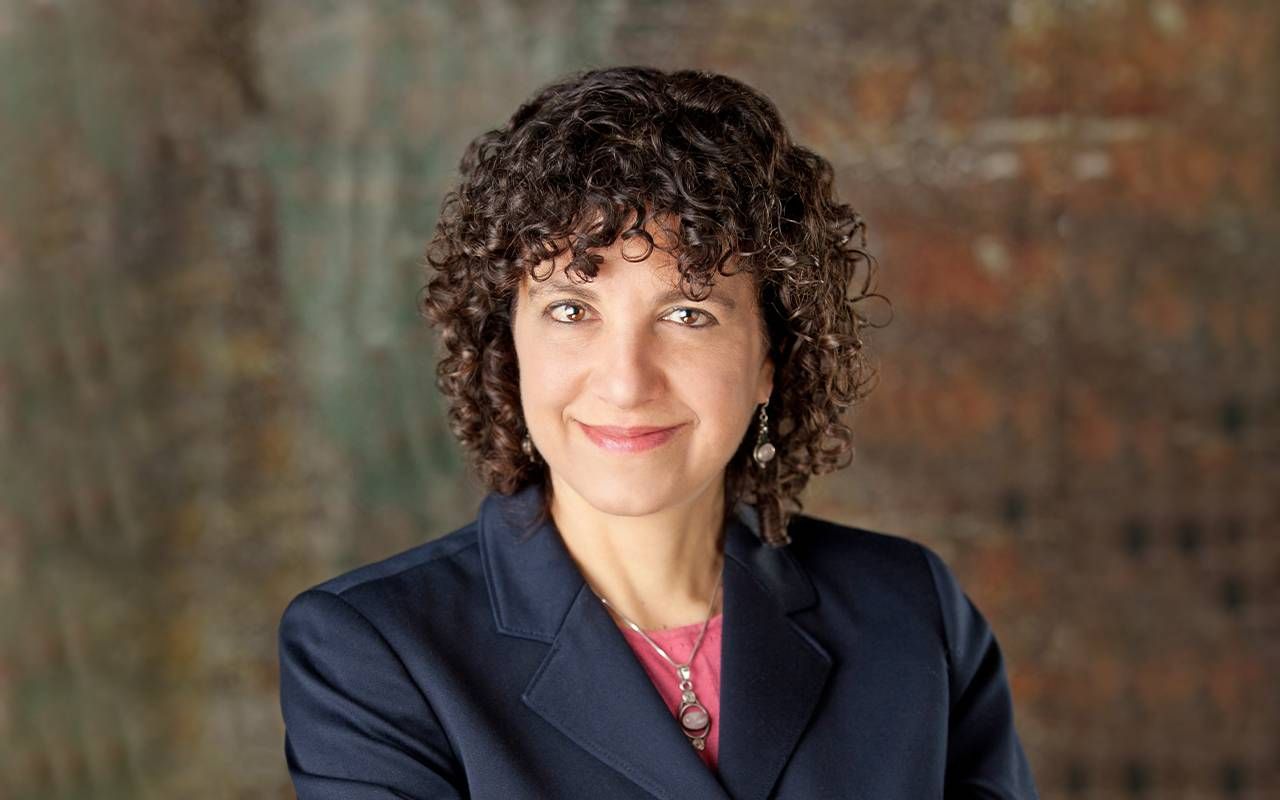 A headshot of a woman with curly hair. Next Avenue, influencers in aging 2022