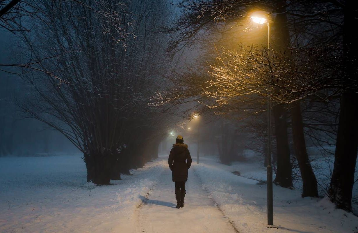A person walking alone in winter. Next Avenue, family estrangement, holidays