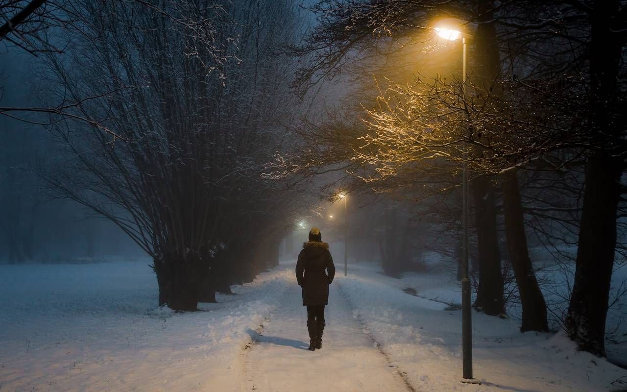 A person walking alone in winter. Next Avenue, family estrangement, holidays