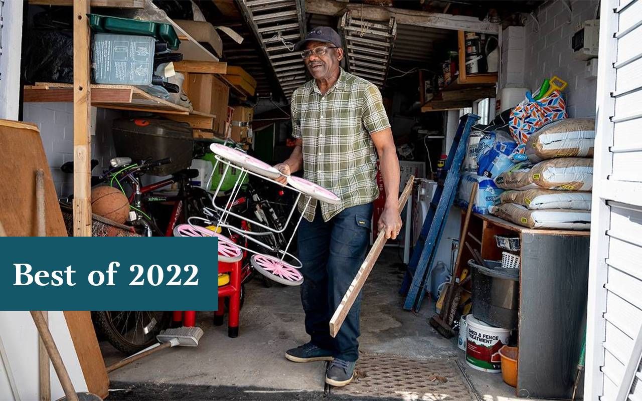 An older man organizing his shed and taking items to be donated. Next Avenue, downsizing, stuff