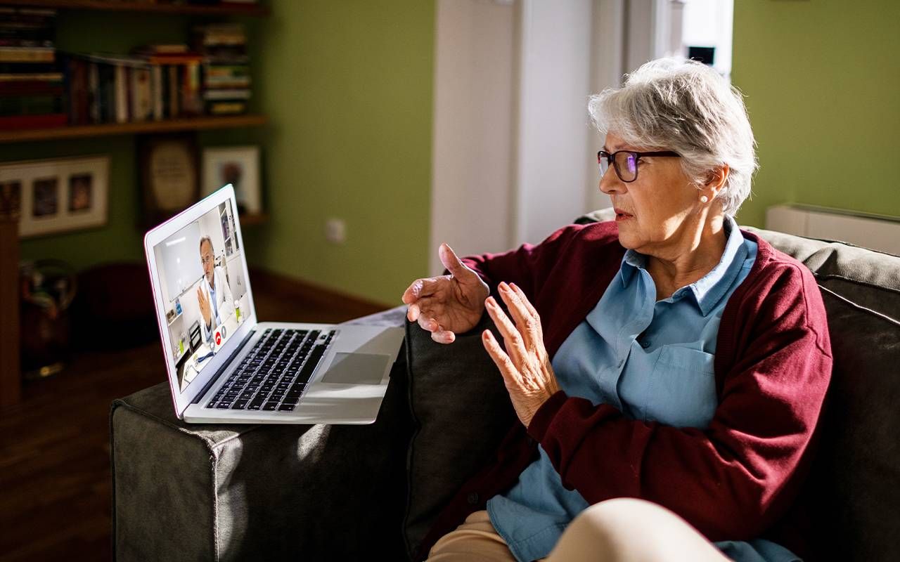 An older adult talking to their doctor. Next Avenue, Epilepsy and Dementia