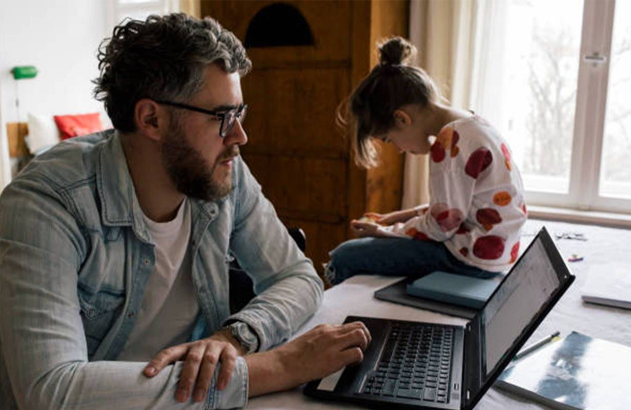 A father and daughter hunched over their computers. Next Avenue, dowager's hump, tech neck, text hump