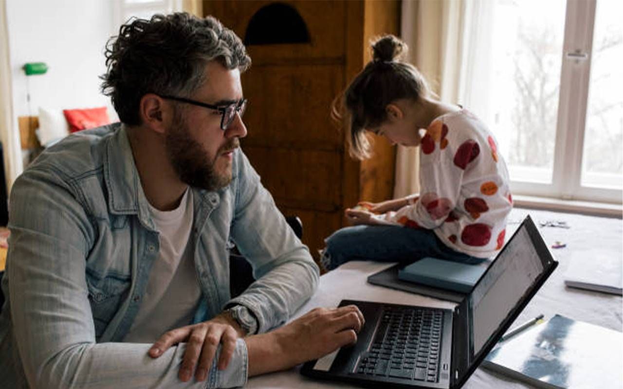 A father and daughter hunched over their computers. Next Avenue, dowager's hump, tech neck, text hump