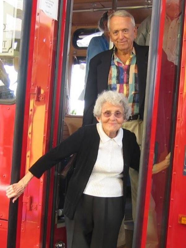 Two older adults getting off a bus. Next Avenue, caregiving for mom