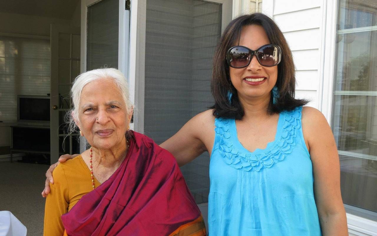 A woman standing with her mom. Next Avenue, caregiving for mom