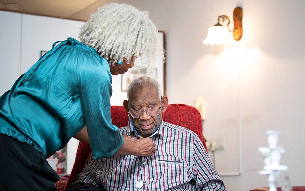A family caregiver caring for her older father. Next Avenue, state's master plan aging