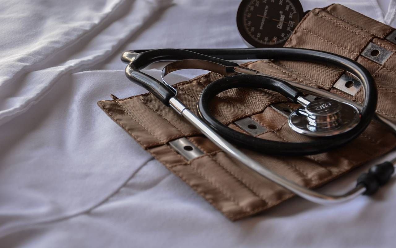 A stethoscope and a blood pressure monitor on a medical table. Next Avenue, retirement, mentoring