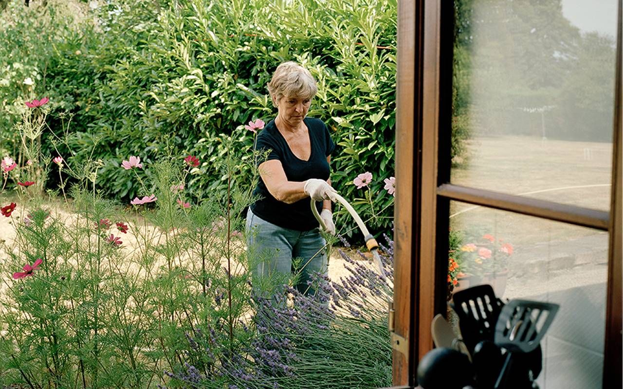 A woman gardening outside. Next Avenue, childfree, aging without children, childless