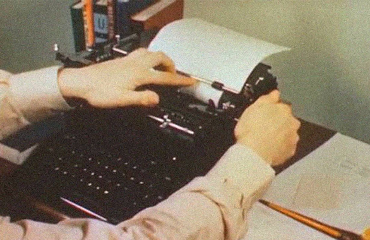 A person using carbon paper in a typewriter. Next Avenue, carbon paper