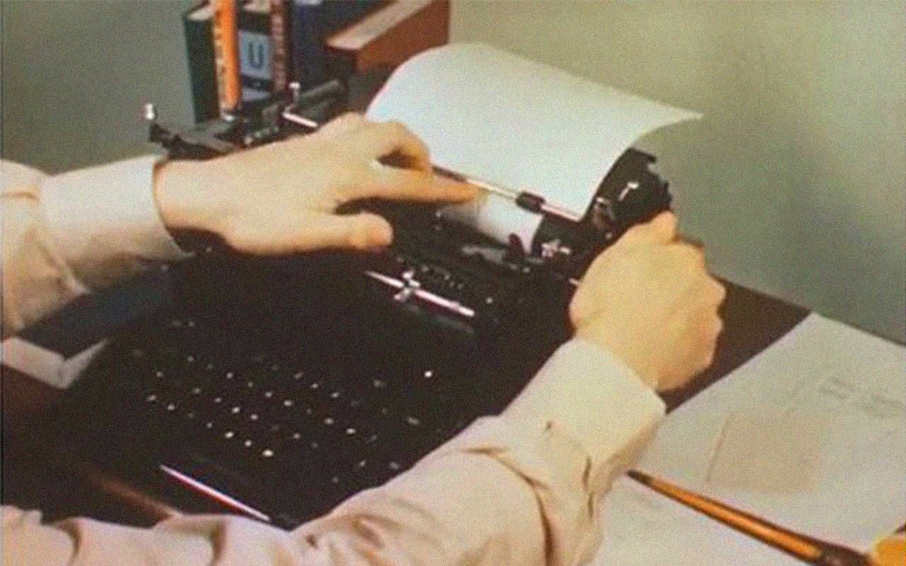 A person using carbon paper in a typewriter. Next Avenue, carbon paper