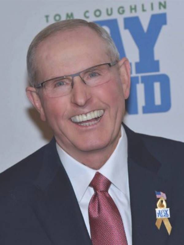 Headshot of a man wearing a suit. Next Avenue, A Giant Win, Tom Coughlin