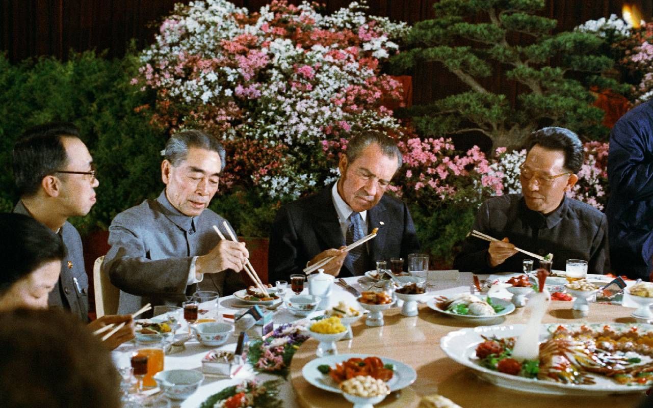 A dim sum style table with several people seated around it. Next Avenue, Dinner with the President, Alex Prud'homme