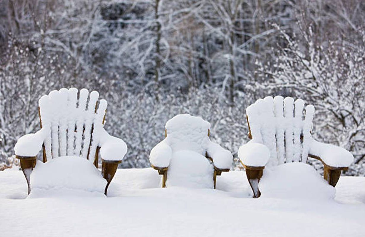 Adirondack chairs covered in snow. Next Avenue, retirement planning