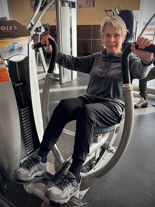 An older adult working out in a gym. Next Avenue, personal trainer for older adult