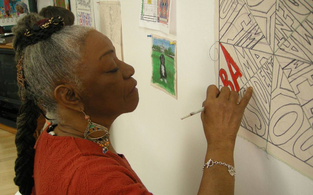 A person painting. Next Avenue, contemporary quilts, Faith Ringgold