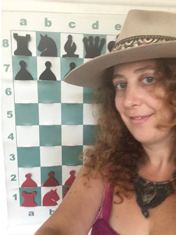 A person standing in front of a chess training board. Next Avenue, brain training with chess