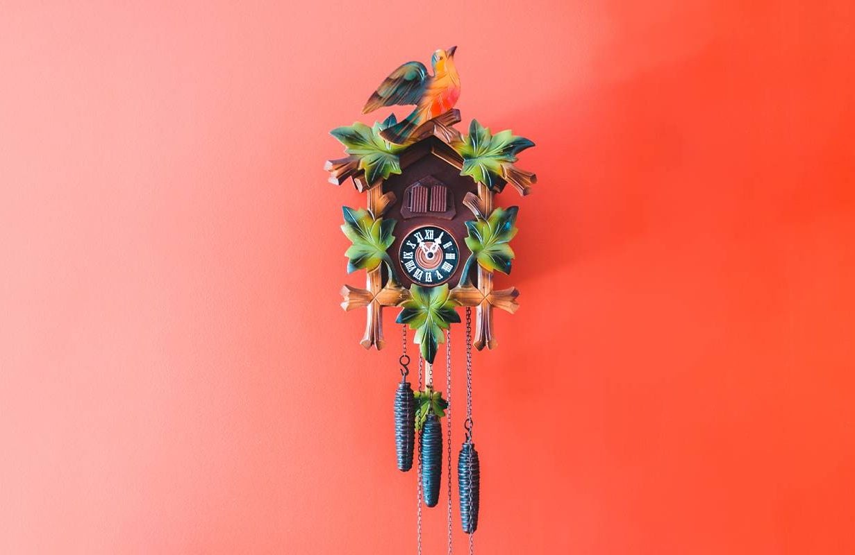 A cuckoo clock on a red wall. Next Avenue, daylight savings time, DST