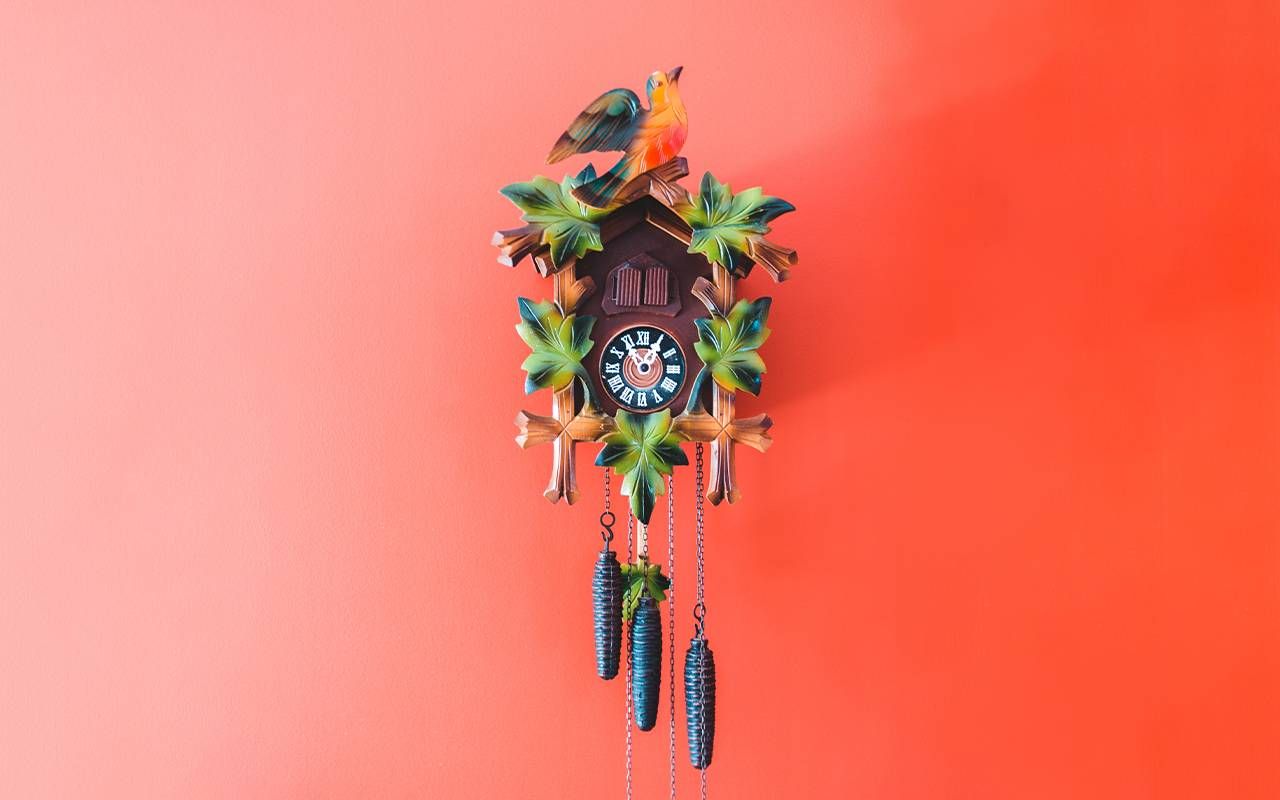 A cuckoo clock on a red wall. Next Avenue, daylight savings time, DST