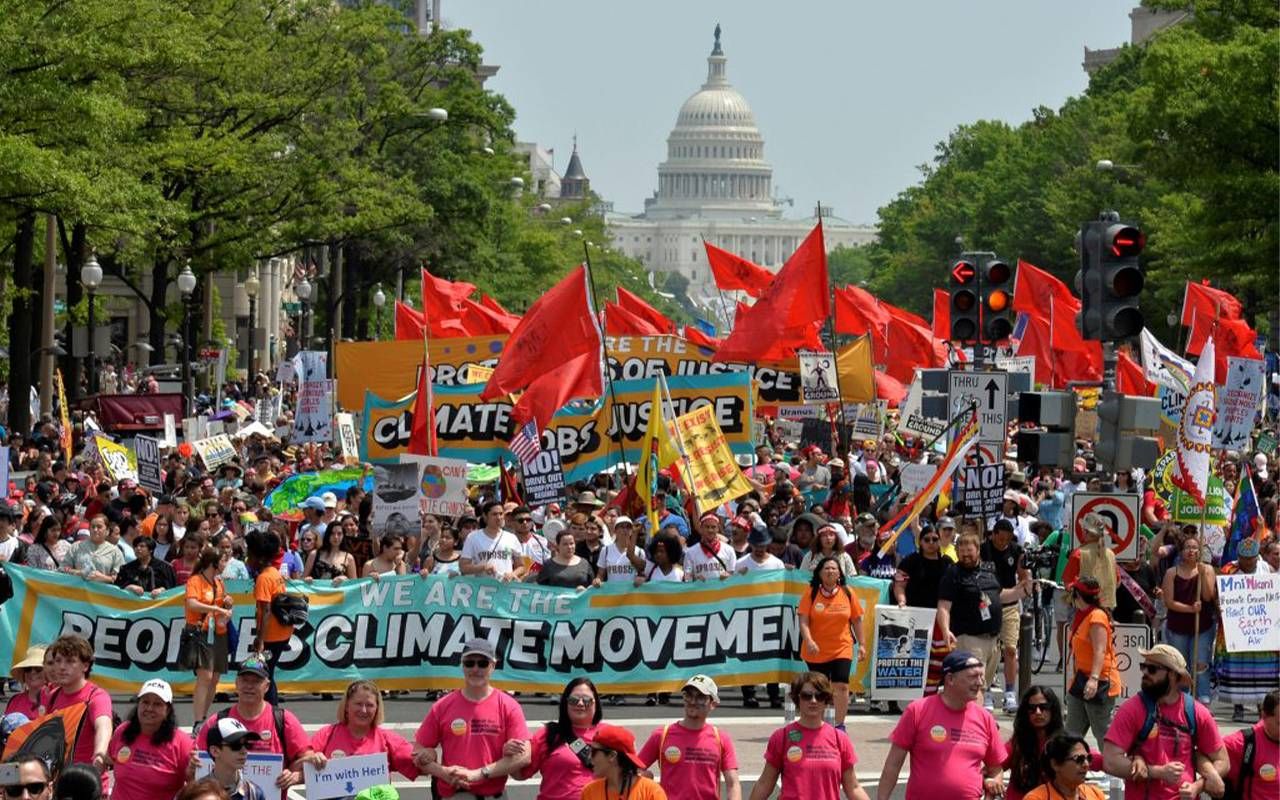 A group of protesters marching. Next Avenue, third act, climate justice