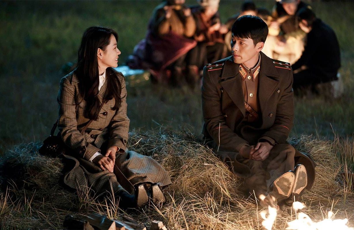 Two people sitting by a fire. Next Avenue, Korean Drama