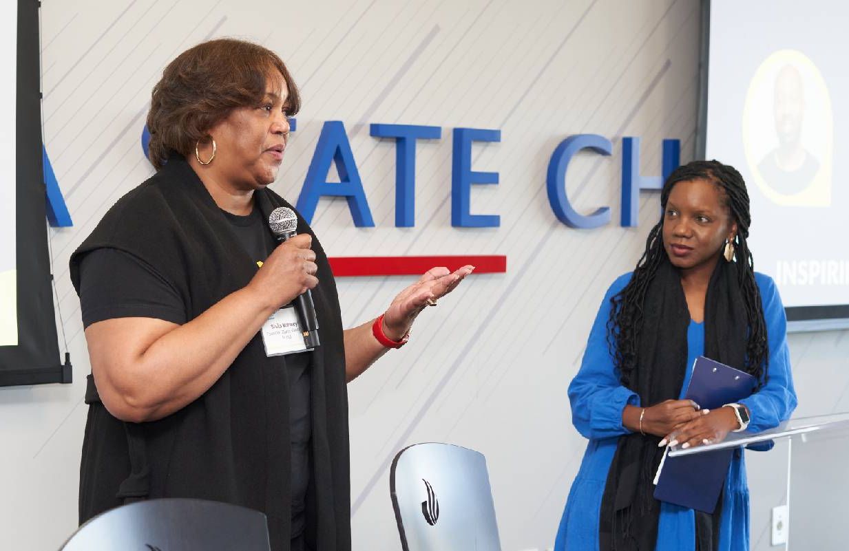 Two women speaking at an event. Next Avenue, small business, entrepreneurs