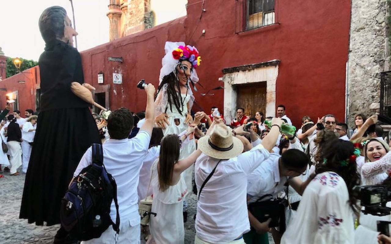 A group of people celebrating in the street. Next Avenue