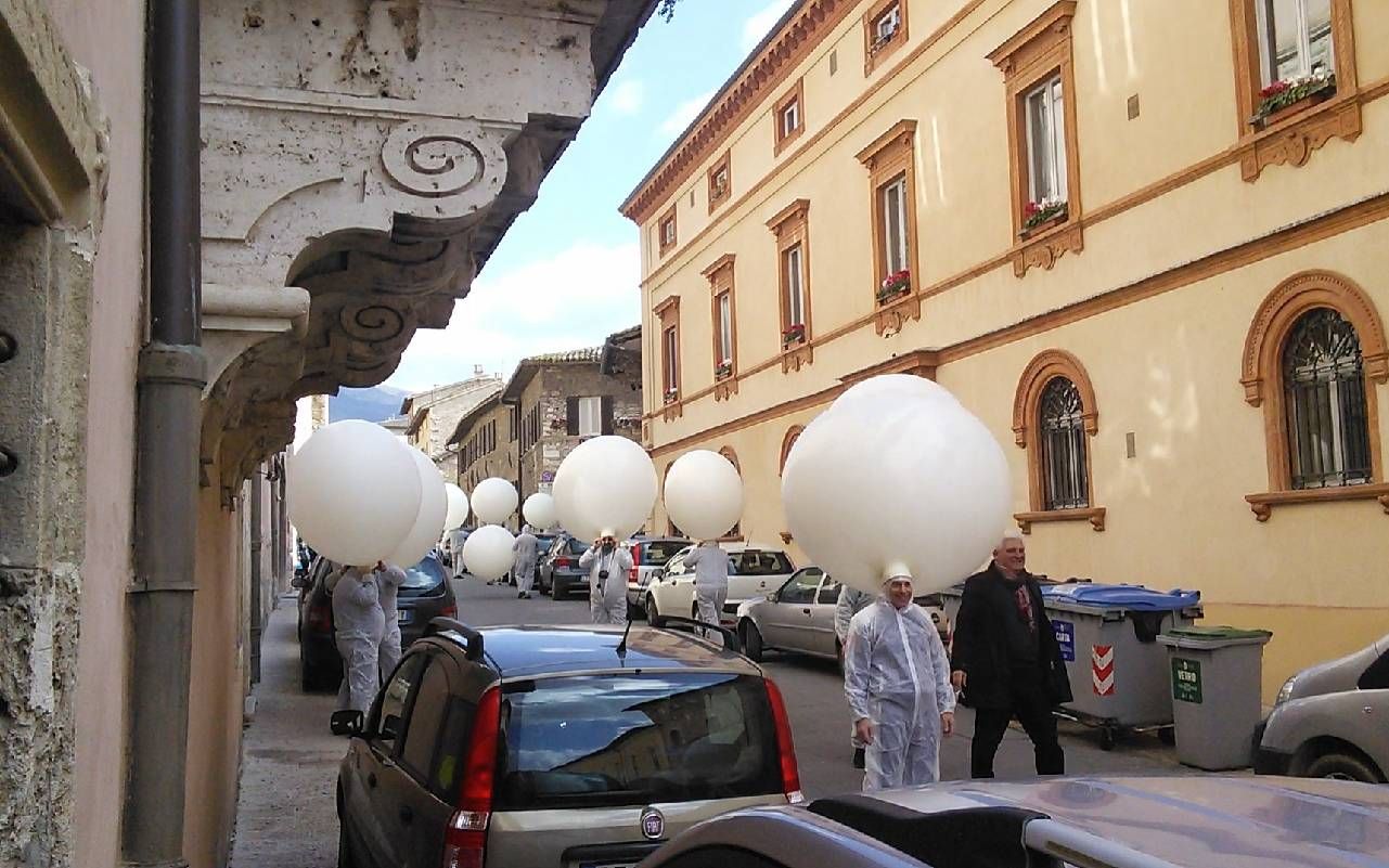 A group of people with balloon-like hats. Next Avenue