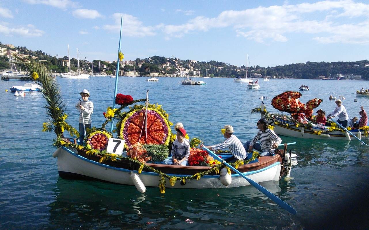 Small boats decorated with flowers. Next Avenue