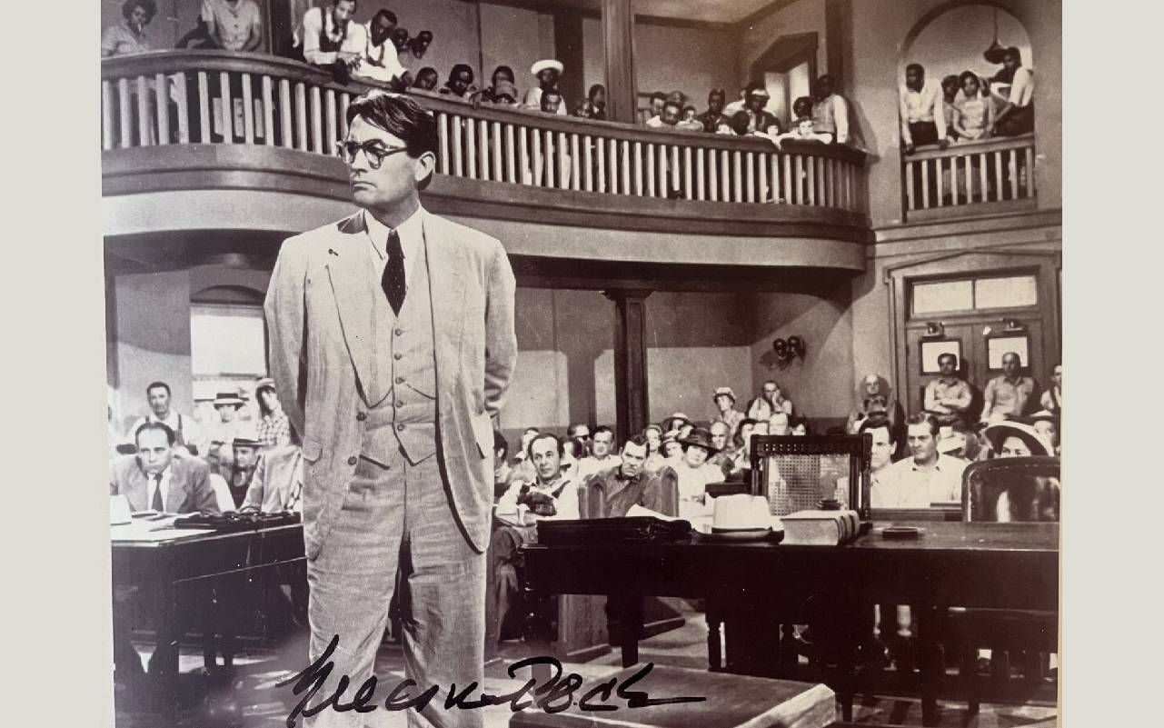 A black and white photo from To Kill A Mockingbird. Next Avenue, Atticus Finch