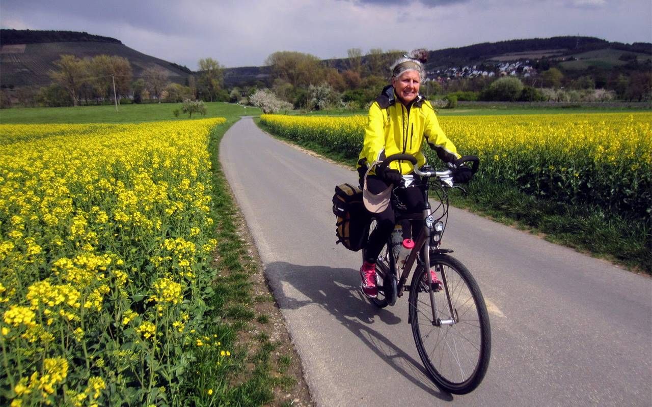 A woman on a bike path. Next Avenue, bicycling, bike tour, denmark