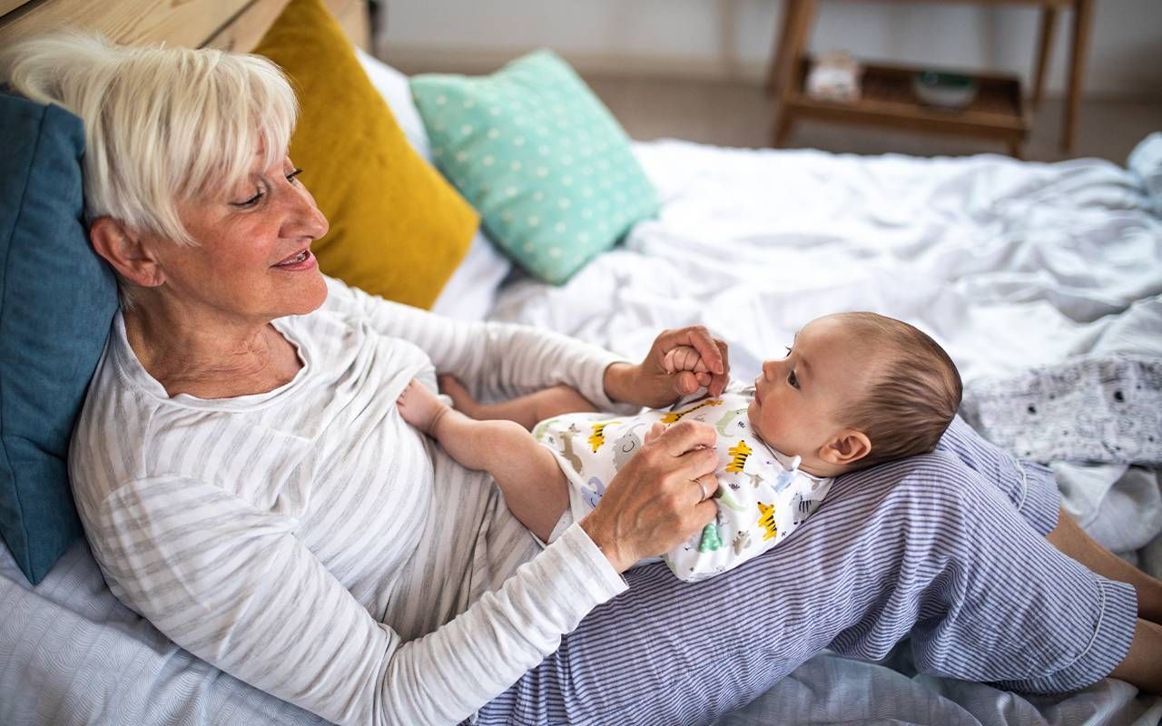 A grandmother caring for her grandchild. Next Avenue, grandparents, day care, caregiving