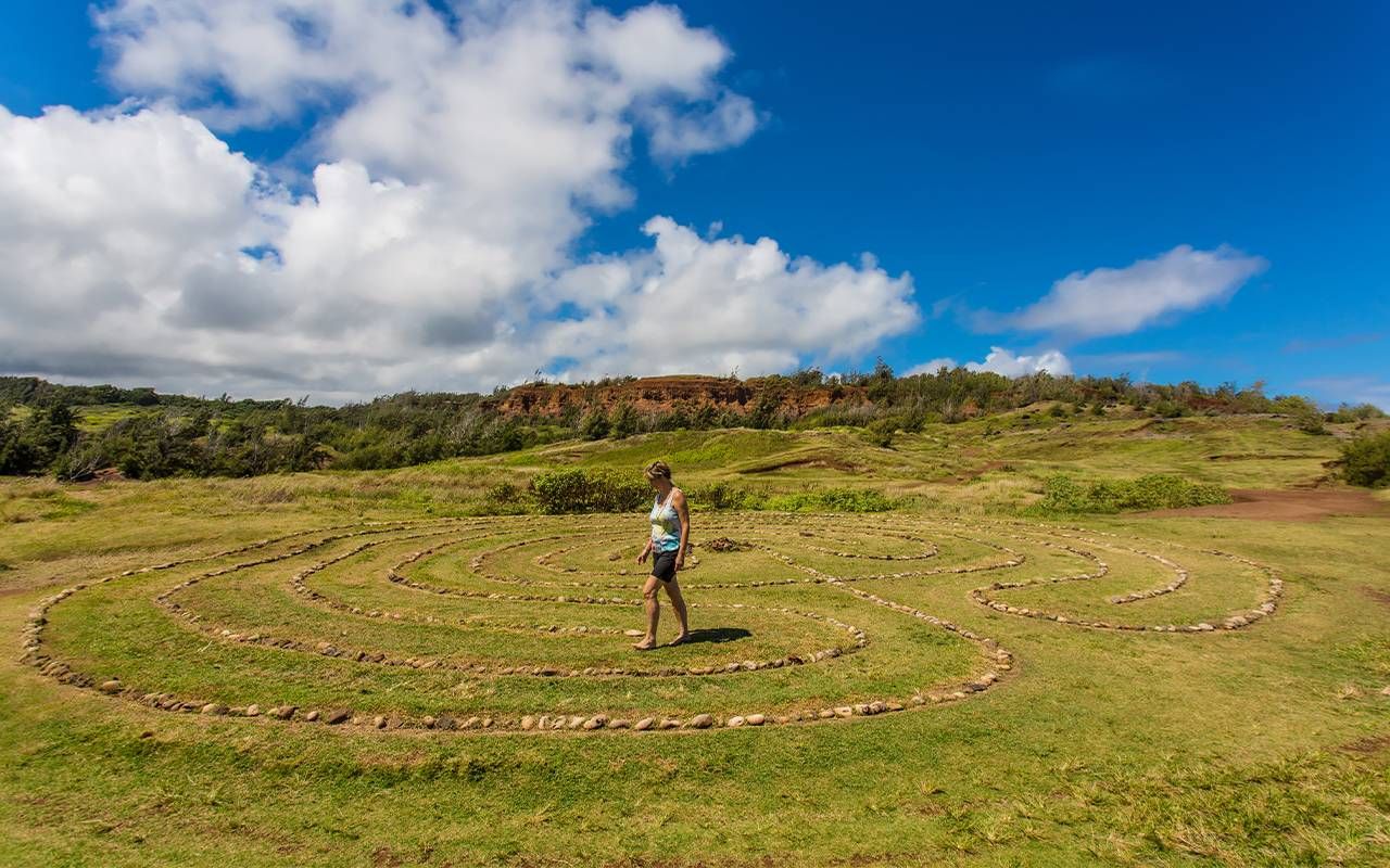 A woman walking a stone labyrinth. Next Avenue