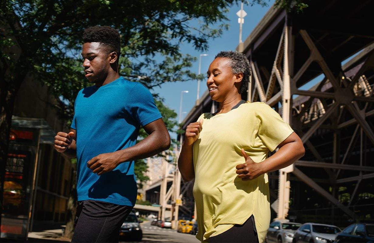 A mother and son jogging together. Next Avenue, healthy people 2030