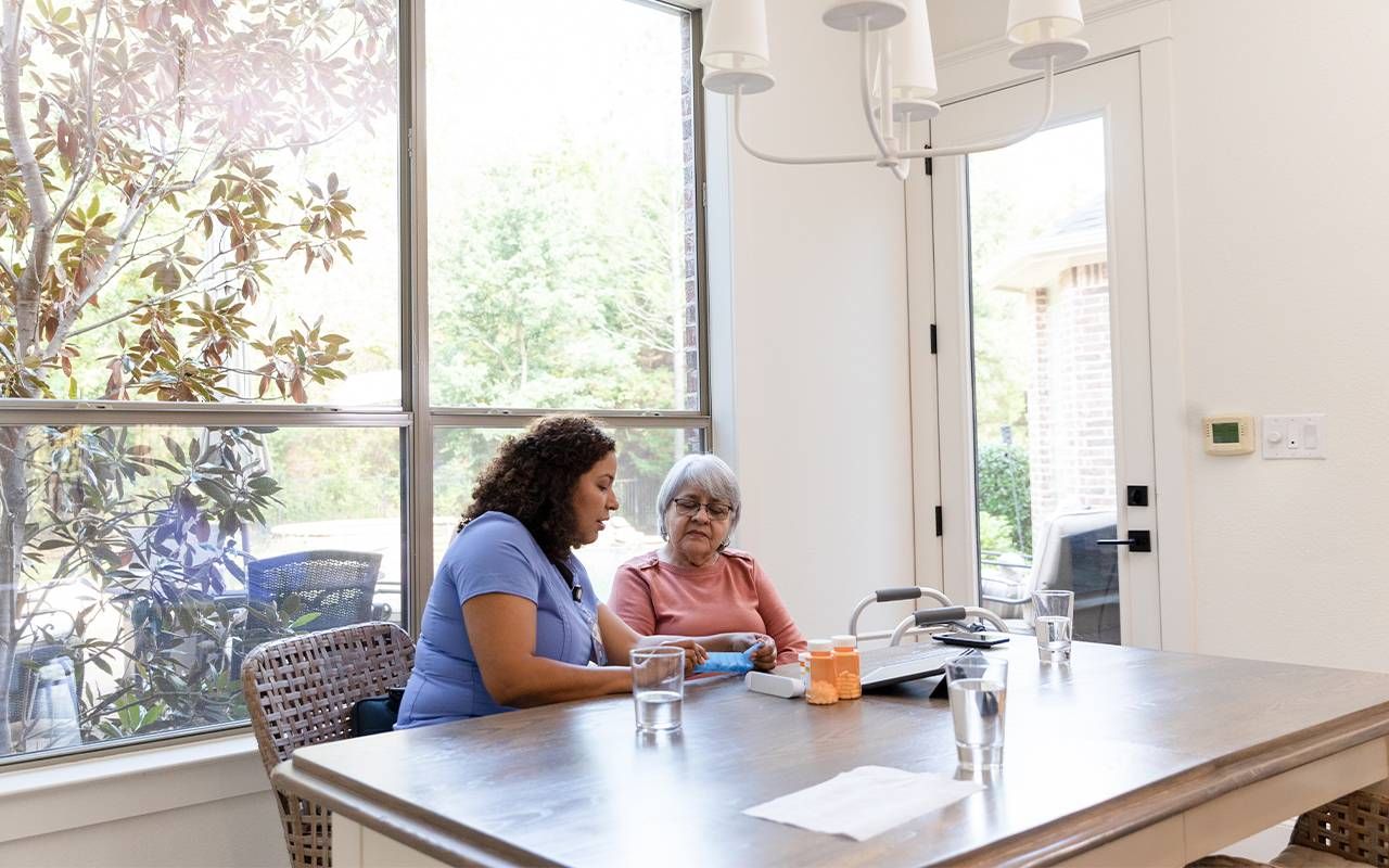 A hospice patient with a nurse at home. Next Avenue, hospice care