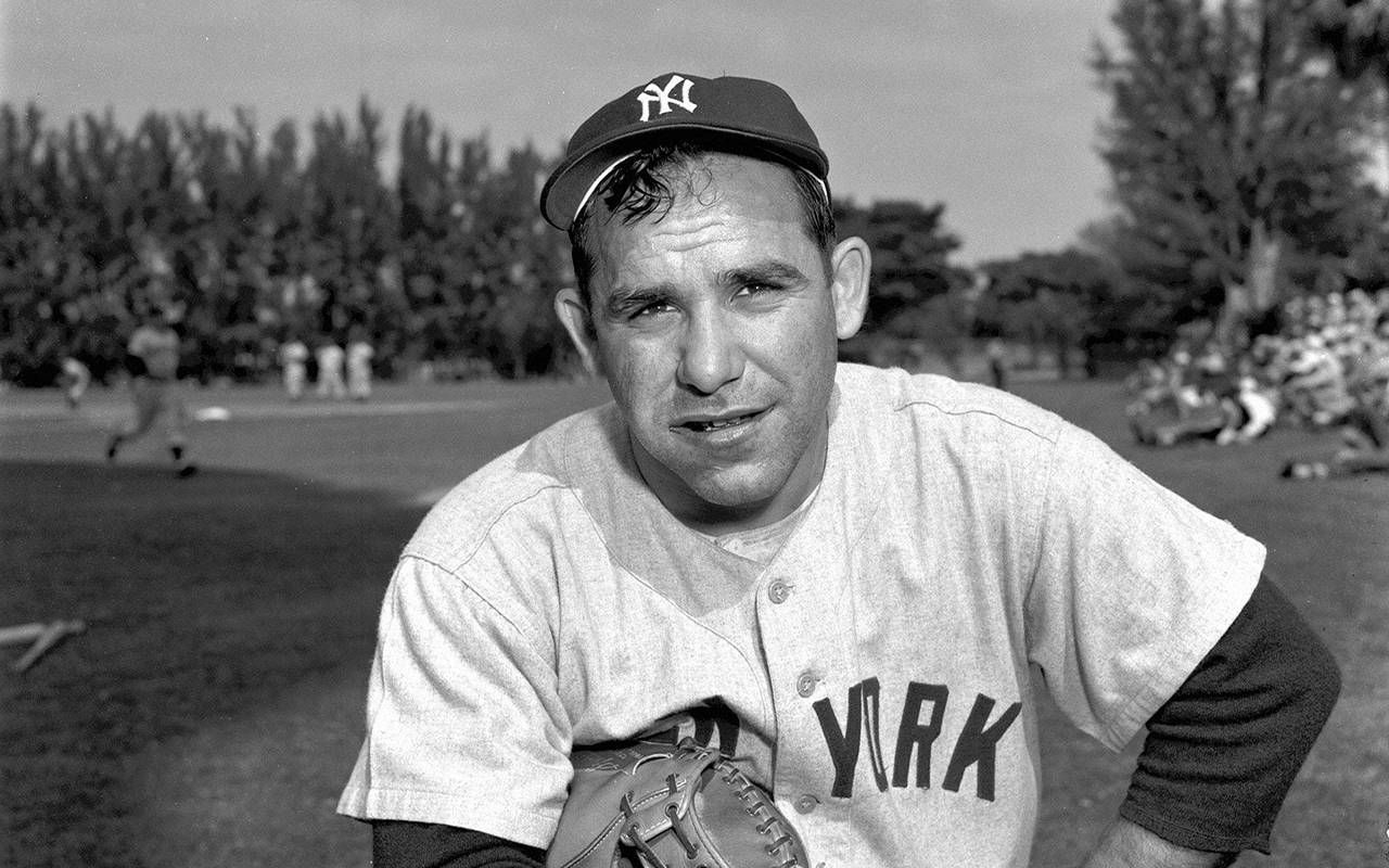 Yogi Berra wearing the 10 World Series rings he won as a player