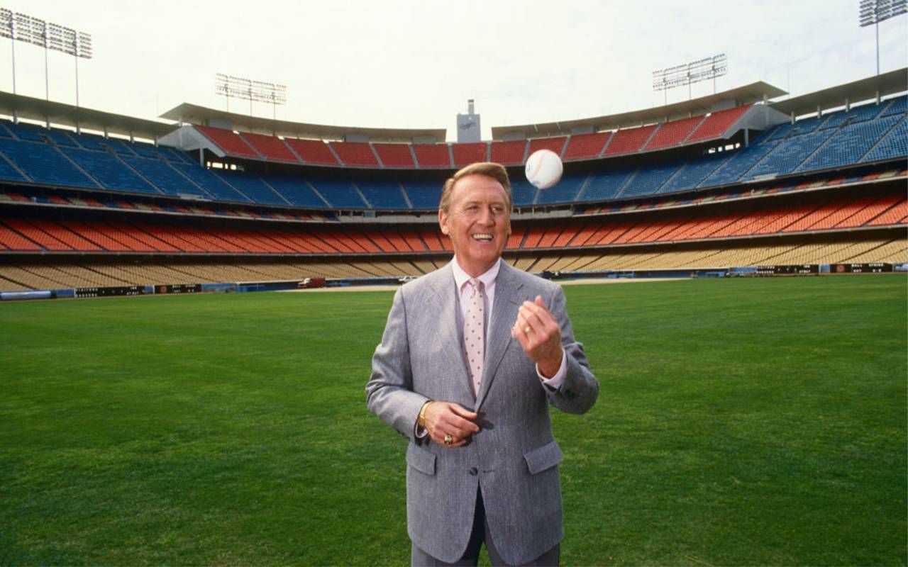 A man standing in a baseball field. Next Avenue, Vin Scully, LA Dodgers