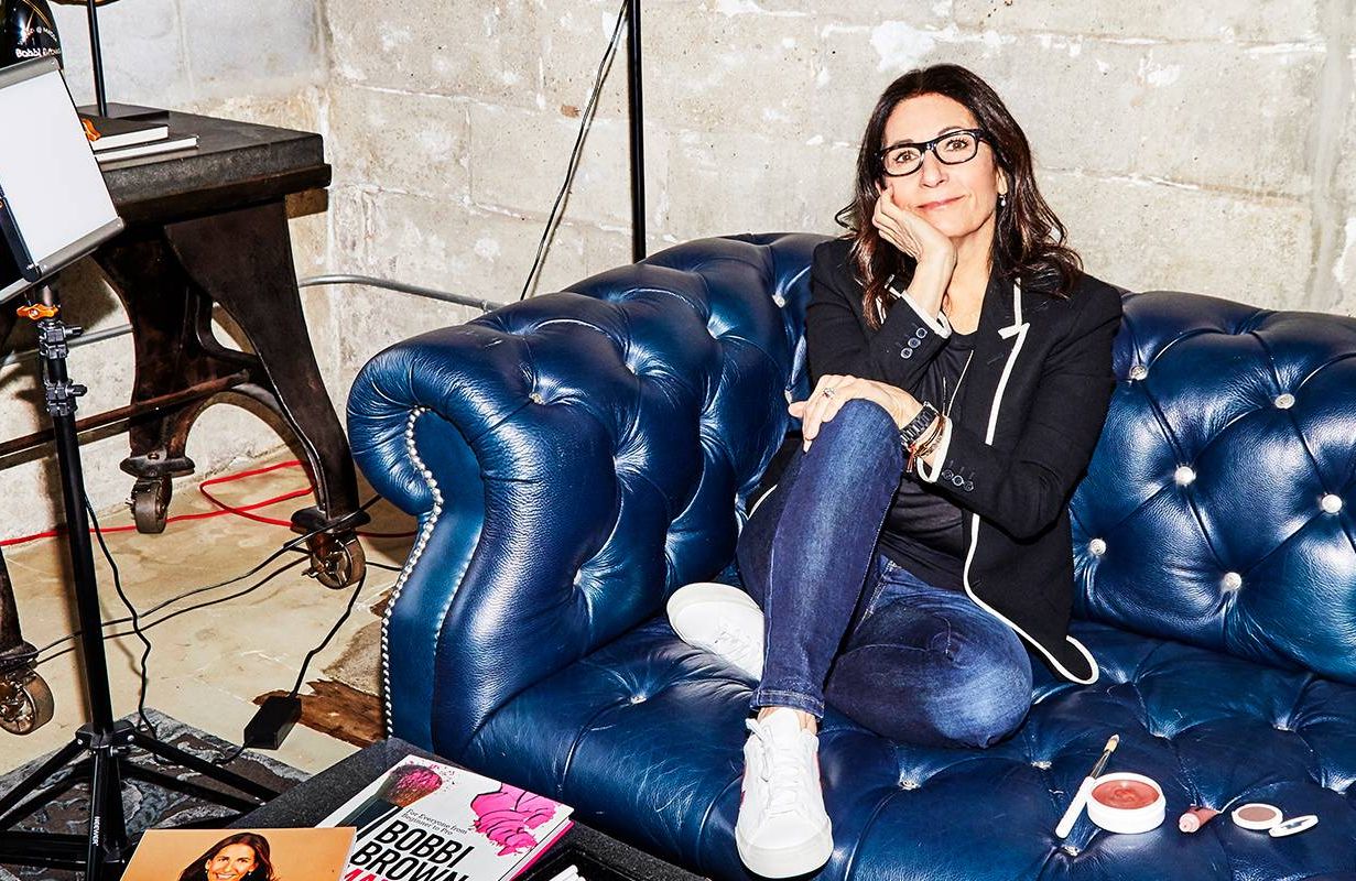Bobbi Brown sitting on a leather couch. Next Avenue, jones road, makeup, business