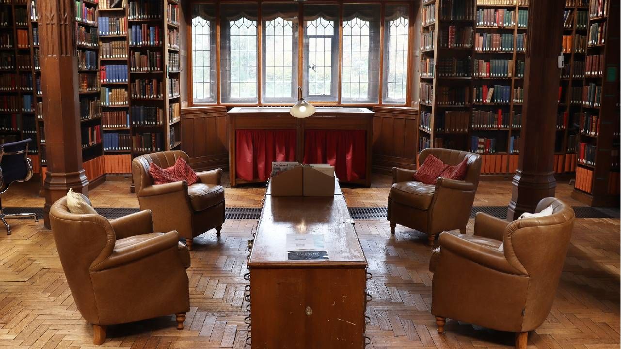 A reading nook with four arm chairs. Next Avenue