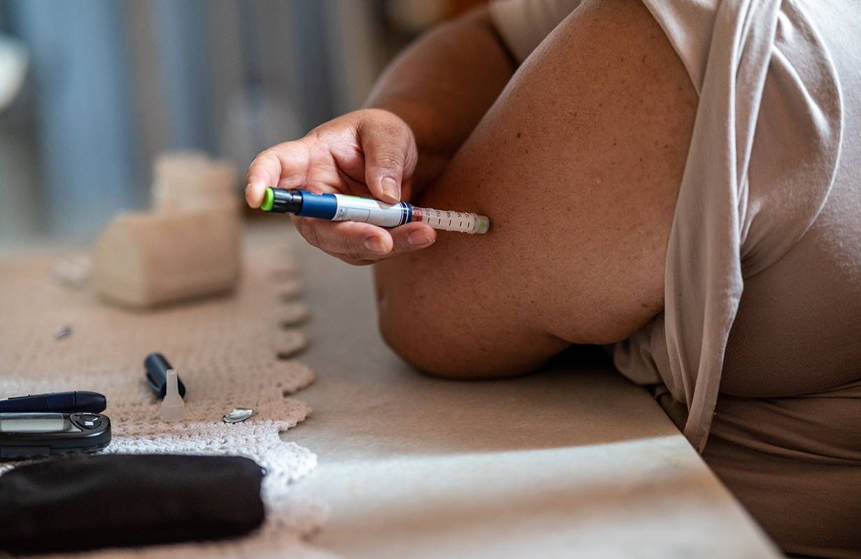 A person taking an insulin shot at home. Next Avenue, diabetes, aging