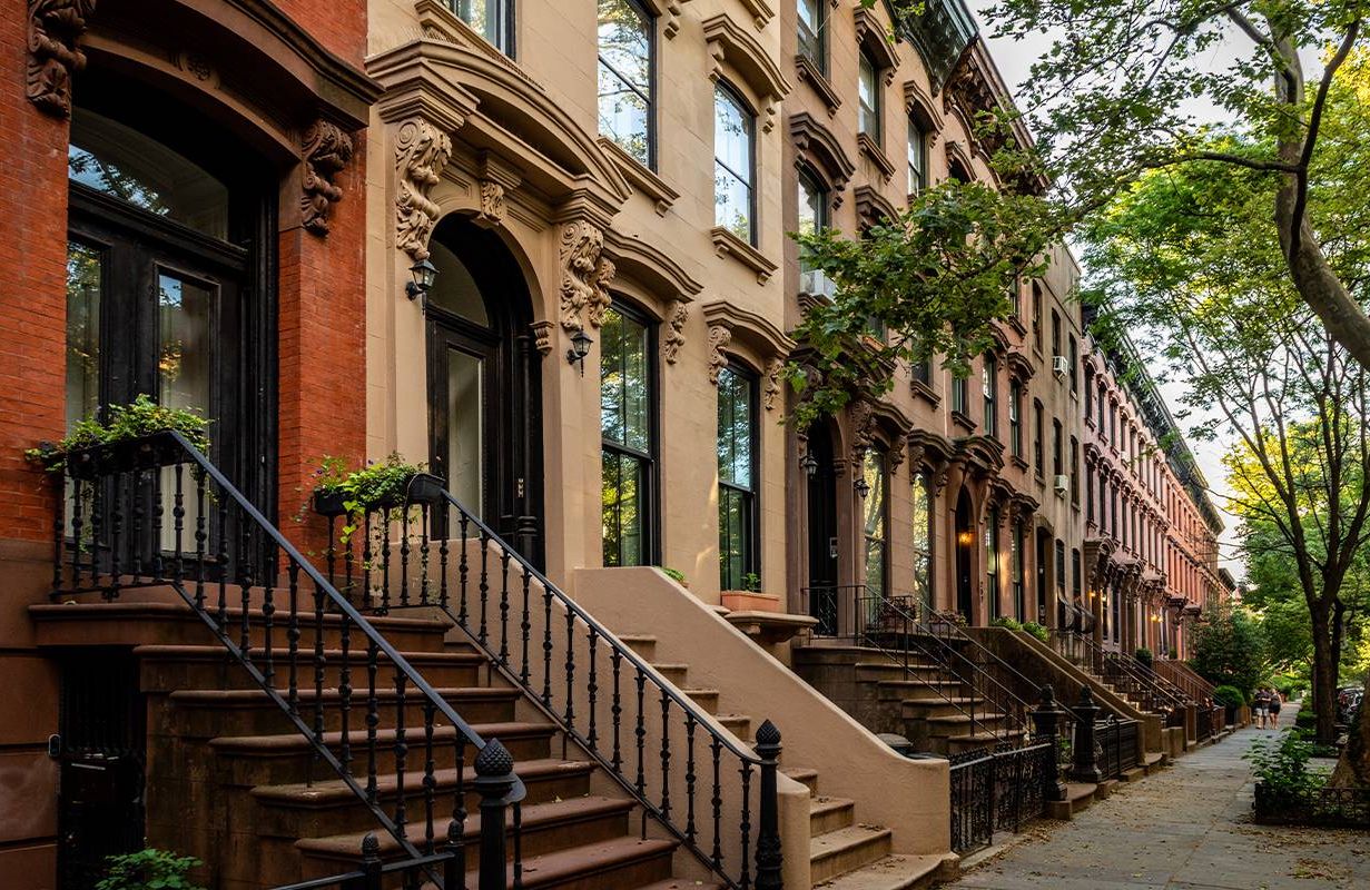 A row of brownstone buildings in New York City. Next Avenue