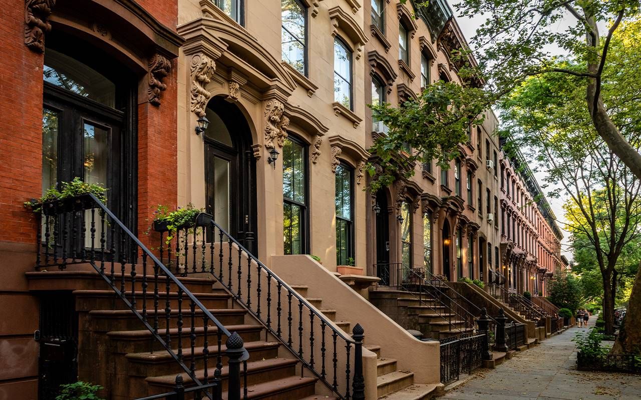 A row of brownstone buildings in New York City. Next Avenue