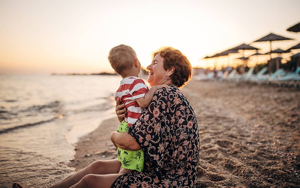 A grandmother hugging her grandson. Next Avenue, in-laws, grandparents