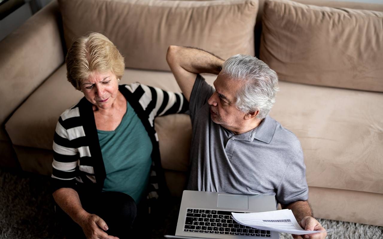 A flustered couple looking at their retirement plan. Next Avenue