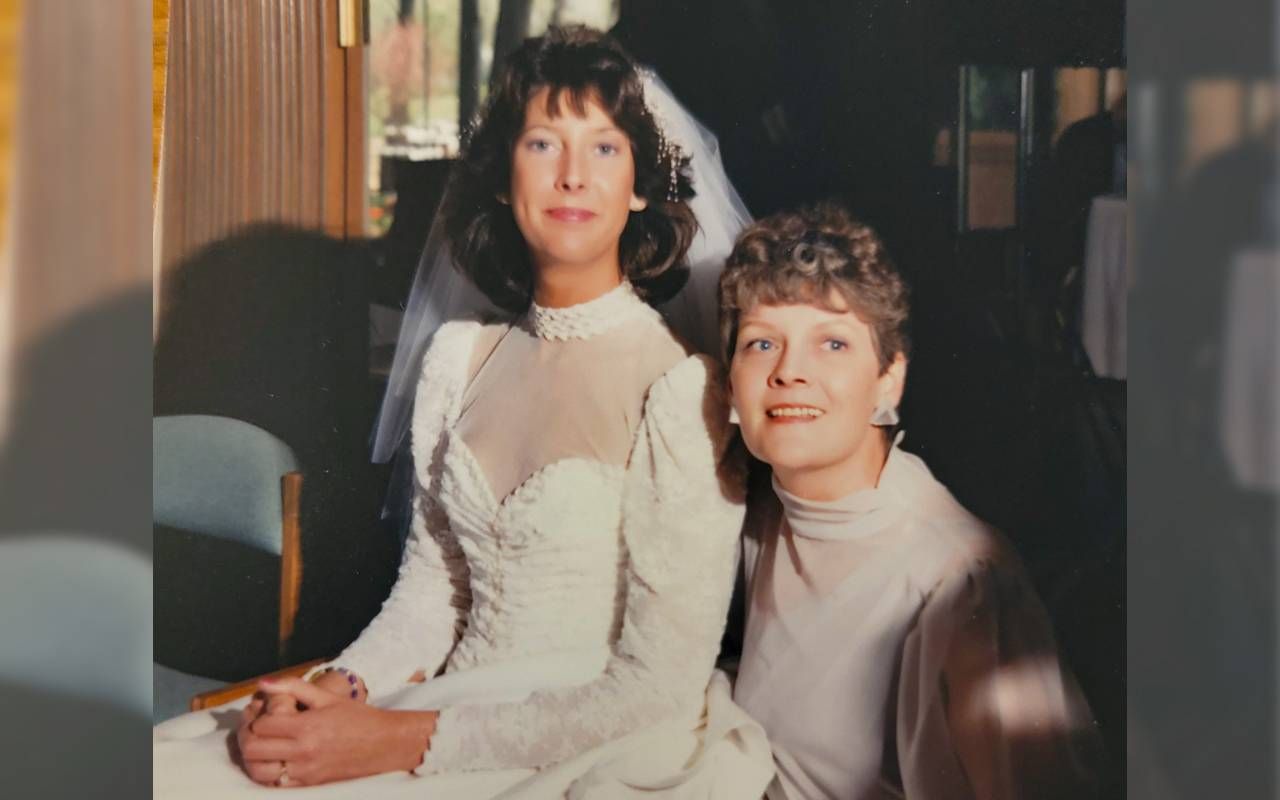 Two women sitting next to each other on one of the wedding day. Next Avenue, wedding dress