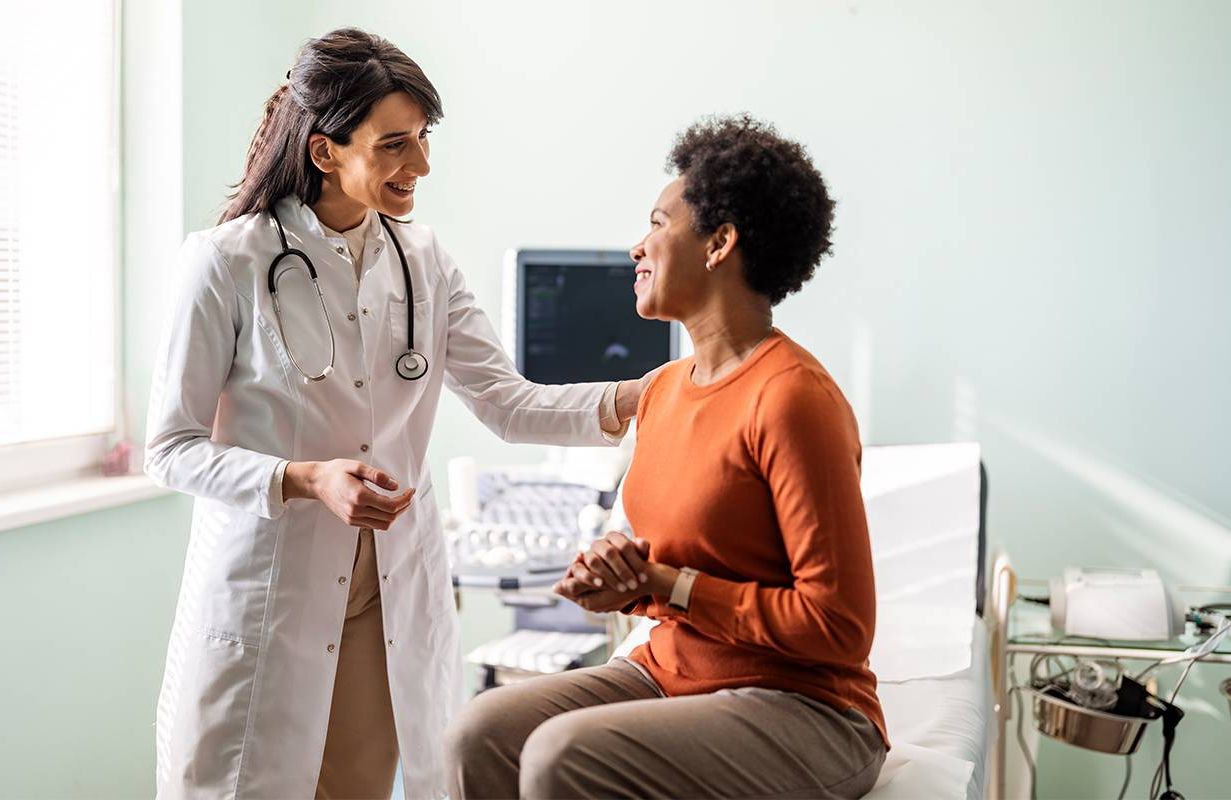 A woman talking to her doctor. Next Avenue