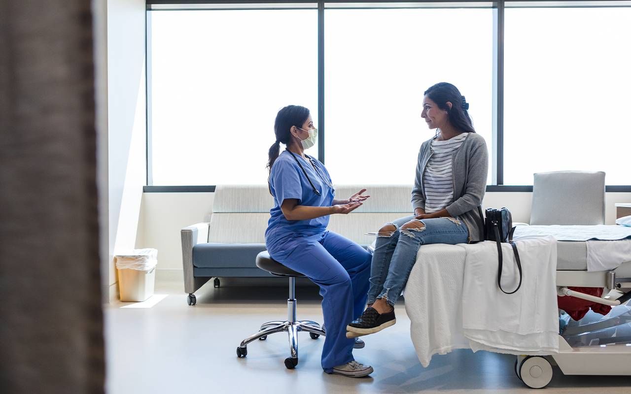 A woman talking to her doctor. Next Avenue