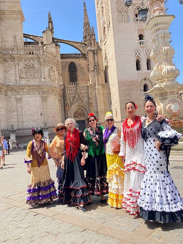 A group wearing Flamenco style dresses. Next Avenue